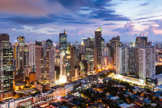 Makati urban skyline illuminated at dusk, Manila, Philippines