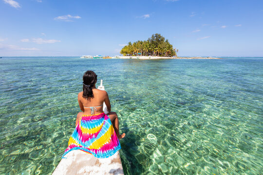 Young woman on boat near Guyam island, Siargao, Philippines