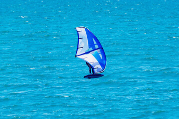 Windsurfer on the sea surface.