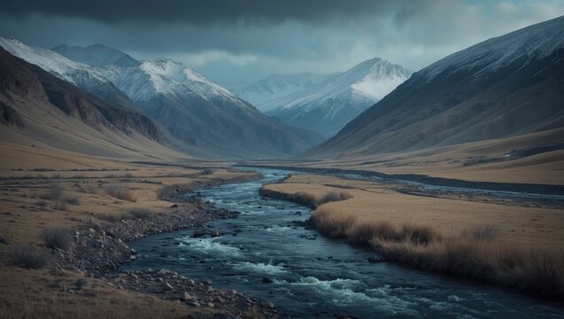 River flowing through a mountainous valley with snow-capped peaks in the background. Scenic landscape. Nature and wilderness. The concept of natural landscapes and outdoor scenery