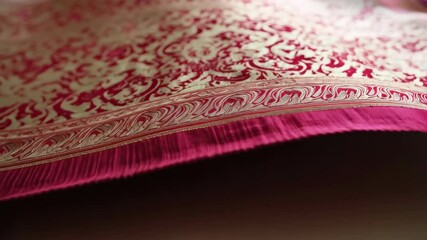 Elegant textile featuring intricate gold leaf pattern on vibrant red backdrop, perfect for traditional design elements and luxurious ornamentation. - Powered by Adobe