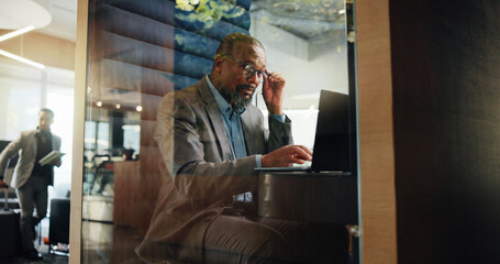 Laptop, planning and typing with business black man in pod for financial reporting. Computer,...