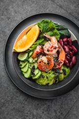 Fresh salad with dressing and nuts