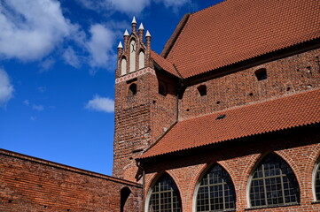 Blue sky with clouds and a brick castle