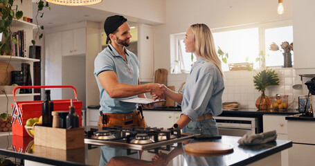 Woman, man and plumber with handshake in kitchen for thanks, report or deal for repair at house....