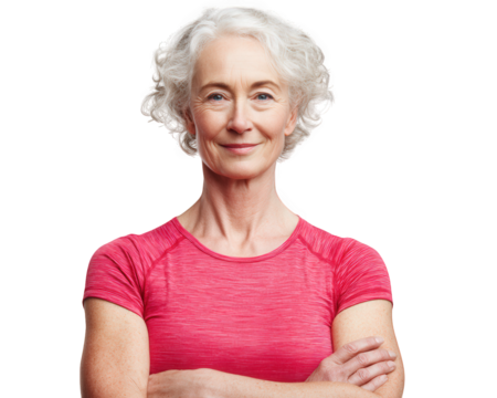 Active older woman in sports clothing, smiling confidently with arms crossed, showcasing healthy lifestyle and fitness. Her vibrant outfit reflects energy and vitality