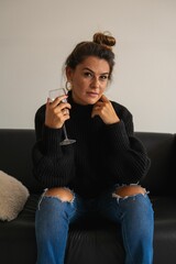 Plakat Woman with red wine on couch