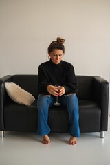 Plakat Woman holding red wine indoors