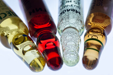 Medical ampoules for injection isolated on a white background. Transparent glass vials with clear liquid used for treatment and vaccination. Sterile pharmaceutical containers in a clinical setting.