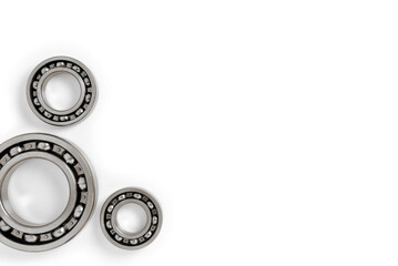 ball bearings on a white background, top view, blank for creativity. Parts for machines and mechanisms in rotation units. copy space