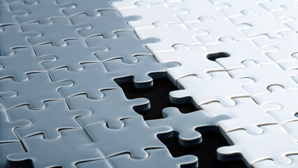 Autistic Adult Neurodivergent Sensory Puzzle pieces arranged in shades of gray, with one piece missing, creating a sense of incompleteness.
