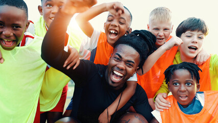 Portrait, group and coach with celebration, soccer or achievement with champion, tournament or cheering. Shout, kids or children with sports, training or football game for players, excited or contest