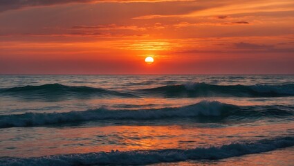 Fototapeta premium Sunset over the ocean with waves, vibrant orange sky, peaceful scene, natural beauty, and calming atmosphere.