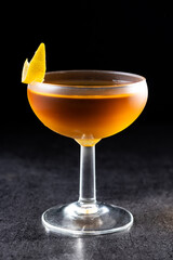 Paper plane cocktail on black slate background