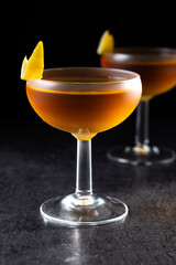Paper plane cocktail on black slate background