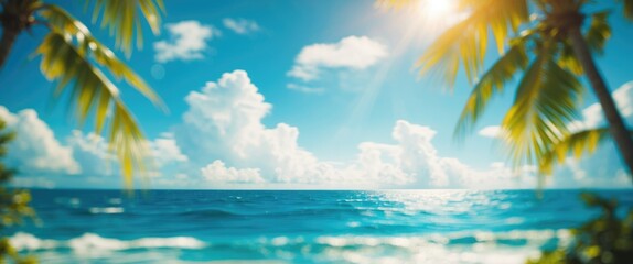 Fototapeta premium A tropical beach scene with palm leaves, blue sky, and ocean waves under bright sunlight. Island paradise and tropical vacation concept.