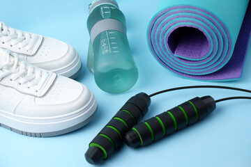 Fitness Equipment. Water Bottle, Jump Rope, Sneakers and Yoga Mat