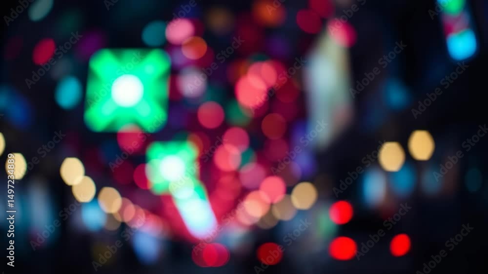 Poster a video showing vibrant blurred lights shining in darkness creating an abstract and colorful spectac
