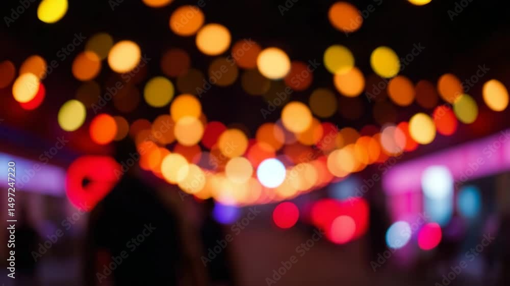Poster a video showing vibrant blurred lights shining in darkness creating an abstract and colorful spectac