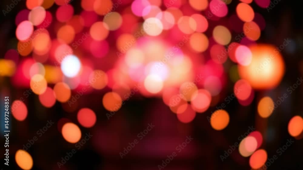 Poster a video showing vibrant blurred lights shining in darkness creating an abstract and colorful spectac