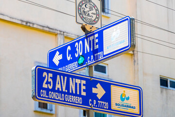 Obraz premium Road street signs name streets roads orientation Playa del Carmen.