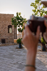 girl travels and takes pictures of sights with her camera. girl with camera. travel and content...