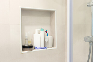 Bathroom niche with personal skin care beauty products. Concept of self-care, morning routine and...