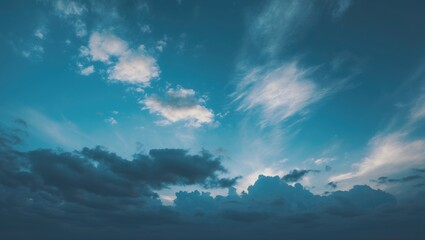 Obraz premium Cloudy sky with blue and white clouds during daytime. Natural sky scene. Atmosphere and weather. The sky and clouds.