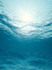 Serene ocean depths tinted pale blue, pierced by shafts of sunlight from the surface