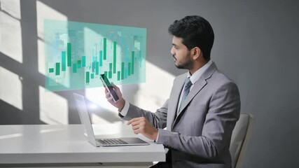 A businessman, possibly male, interacting with a translucent screen displaying charts and data, symbolizing finance, technology, and analytics. Ideal for corporate and tech themes. - Powered by Adobe