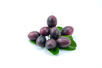 Close up of fresh Bengal-currants, Carandas-plum , Karanda  with green leaves, isolated on white background close up stack