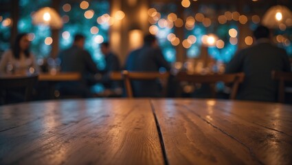 Fototapeta premium Cafe restaurant background featuring a wooden table surface and blurred lighting for selective focus.