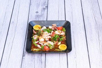green papaya, yard-long beans, tomatoes, chilies, lime juice, fish sauce, palm sugar, garlic, and optionally, sun-dried shrimp, salted crab, or fermented fish