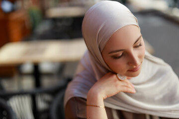 beautiful young face of caucasian muslim woman in hijab	
