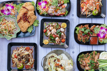 green papaya, yard-long beans, tomatoes, chilies, lime juice, fish sauce, palm sugar, garlic, and optionally, sun-dried shrimp, salted crab, or fermented fish