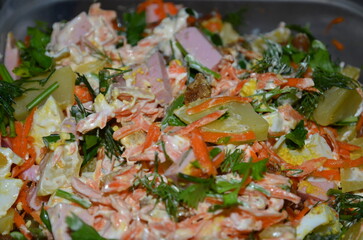 
Mixed ingredients in the process of preparing a delicious salad.
