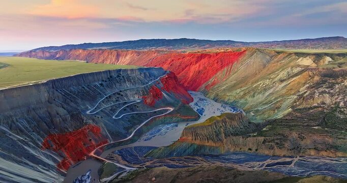 Spectacular Anjihai Grand Canyon natural landscape at sunset in Xinjiang, China. Aerial view of mountain faults and canyon rivers.