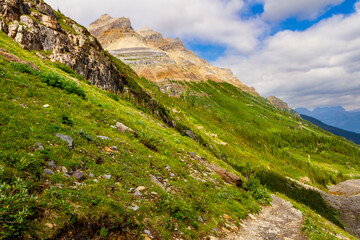 Hiking trail to Plain of Six Glaciers. Narrow path in the mountains. The Rocky Mountains. Banff...