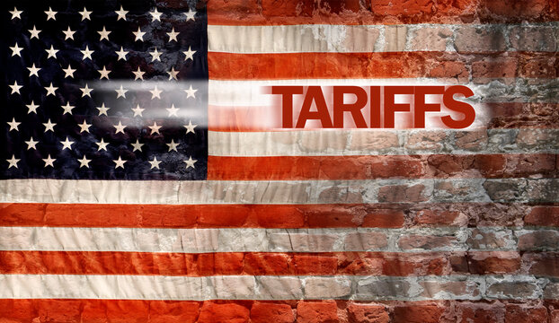 American flag and tariffs hitting into brick wall