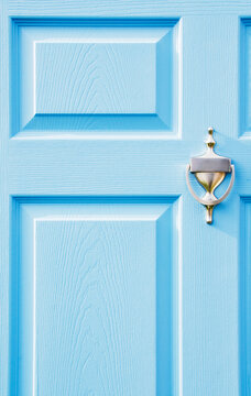 Blue door with brass knocker