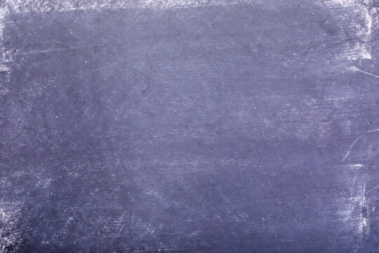Blank textured surface of black chalkboard