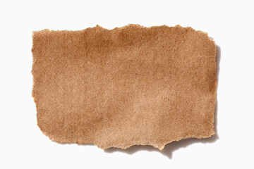 Torn brown paper on white background
