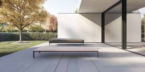 Modern outdoor lounge area with minimalist design and natural surroundings in a sunny setting
