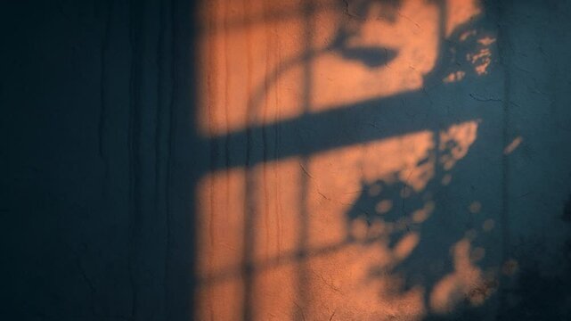 4K Seamless loop of dramatic streetlamp and tree shadows on dark old wall, moody animation, cinematic lighting, atmospheric background for true crime themes, mystery storytelling, and noir visual