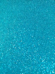 Abstrakcyjne błyszczące, brokatowe tło w kolorze niebieskim 