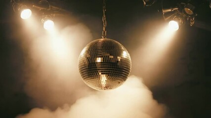 A shining disco ball reflecting light, symbolizing celebration, party, and retro entertainment. Ideal for event, music, and festive themes.