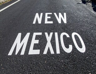 New mexico road sign on asphalt street in bright sunlight