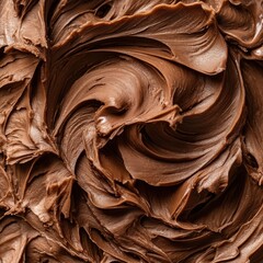 Rich swirls of chocolate frosting create a decadent and visually appealing texture pattern