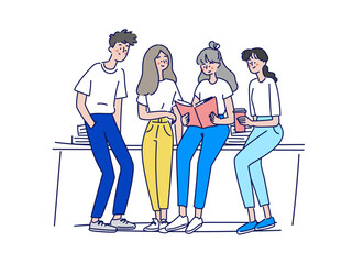 本を囲んで談笑する学生グループ