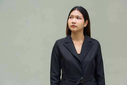 portrait of a young businesswoman thinking